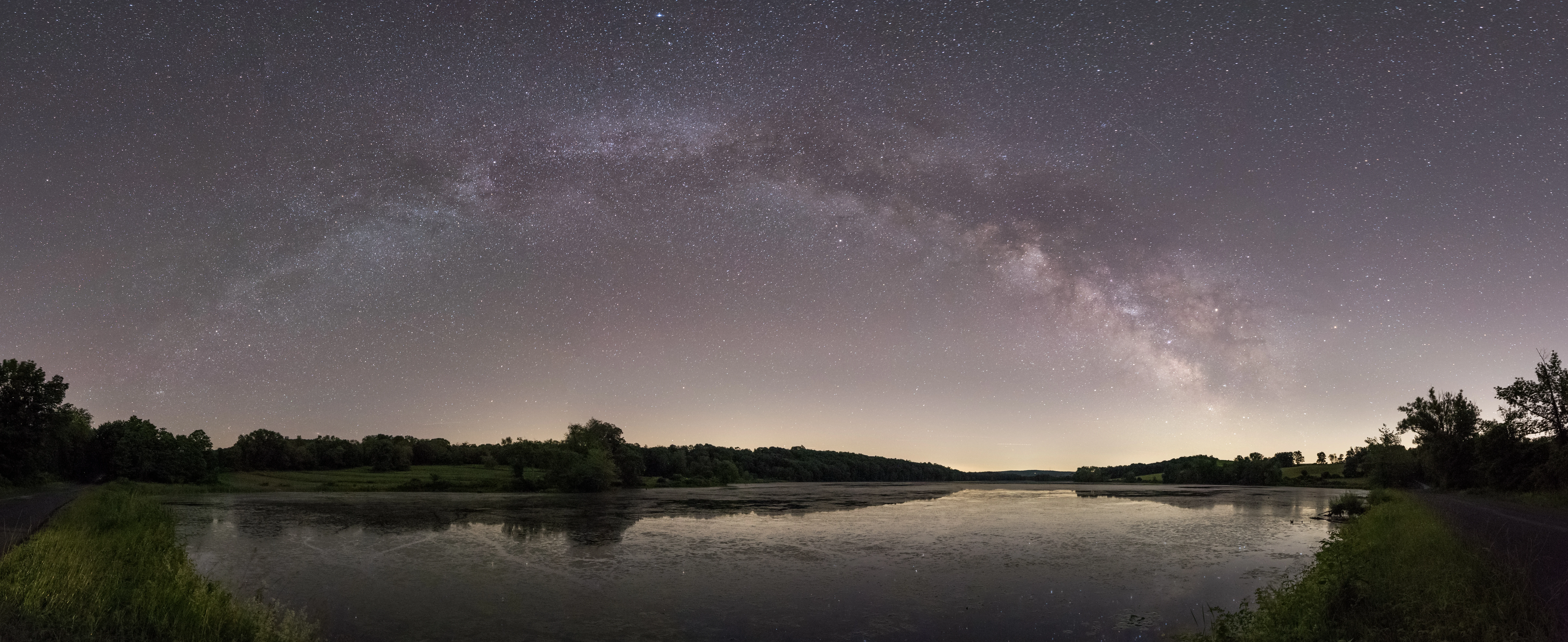 Milky Way panorama over a lake at night