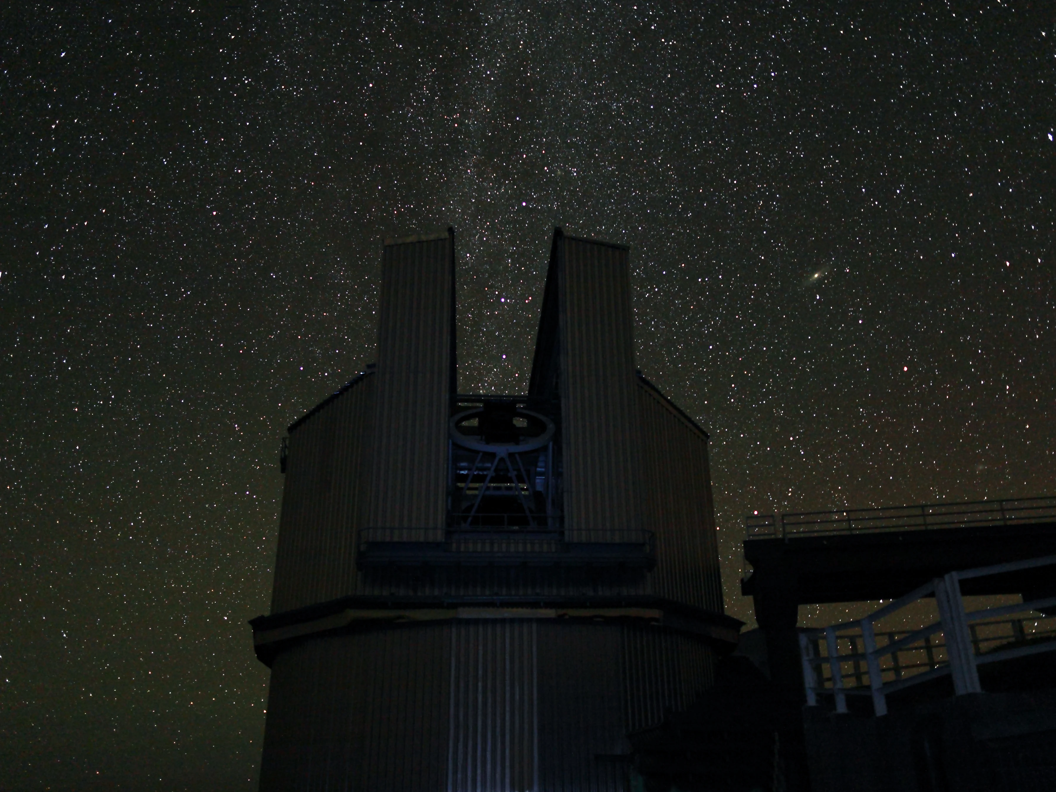 The Telescopio Nazionale Galileo at Roque de los Muchachos Observatory on La Palma, with the Andromeda galaxy visible in the night sky