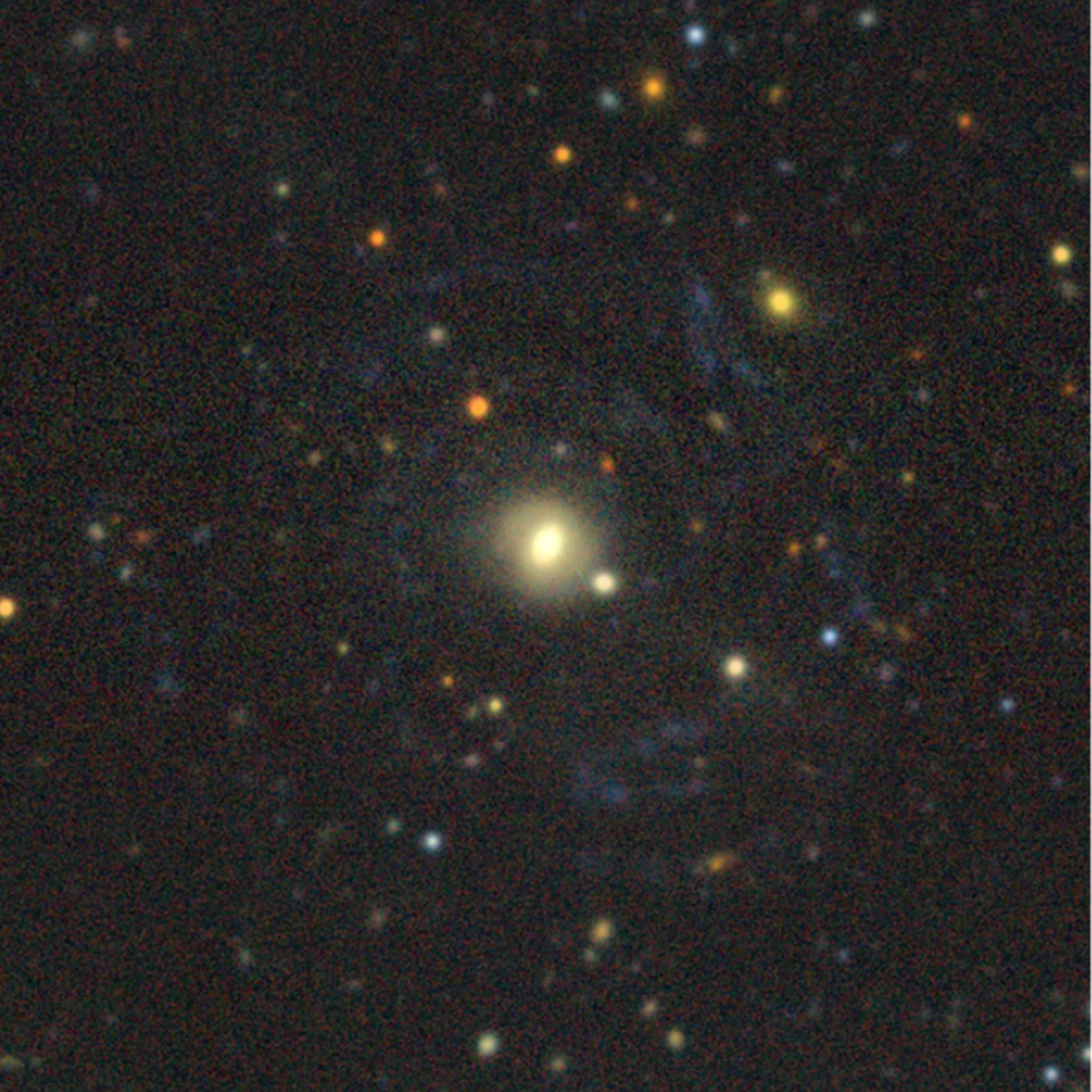 The faint giant low-surface-brightness galaxy Malin 1, a sprawling pale spiral against a field of smaller galaxies, imaged in colour by the DESI Legacy Imaging Survey, one of the sky surveys used to train astronomical foundation models.